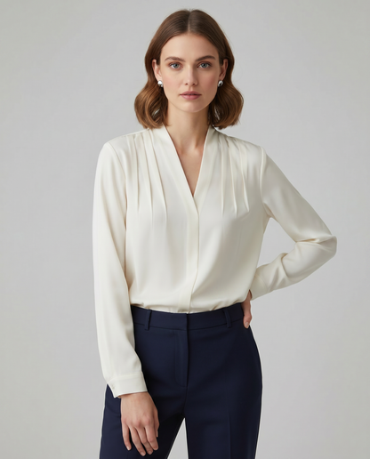 Blusa con maniche a sbuffo e vita sagomata