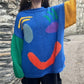 Oversized sweaters with smiley face design 1