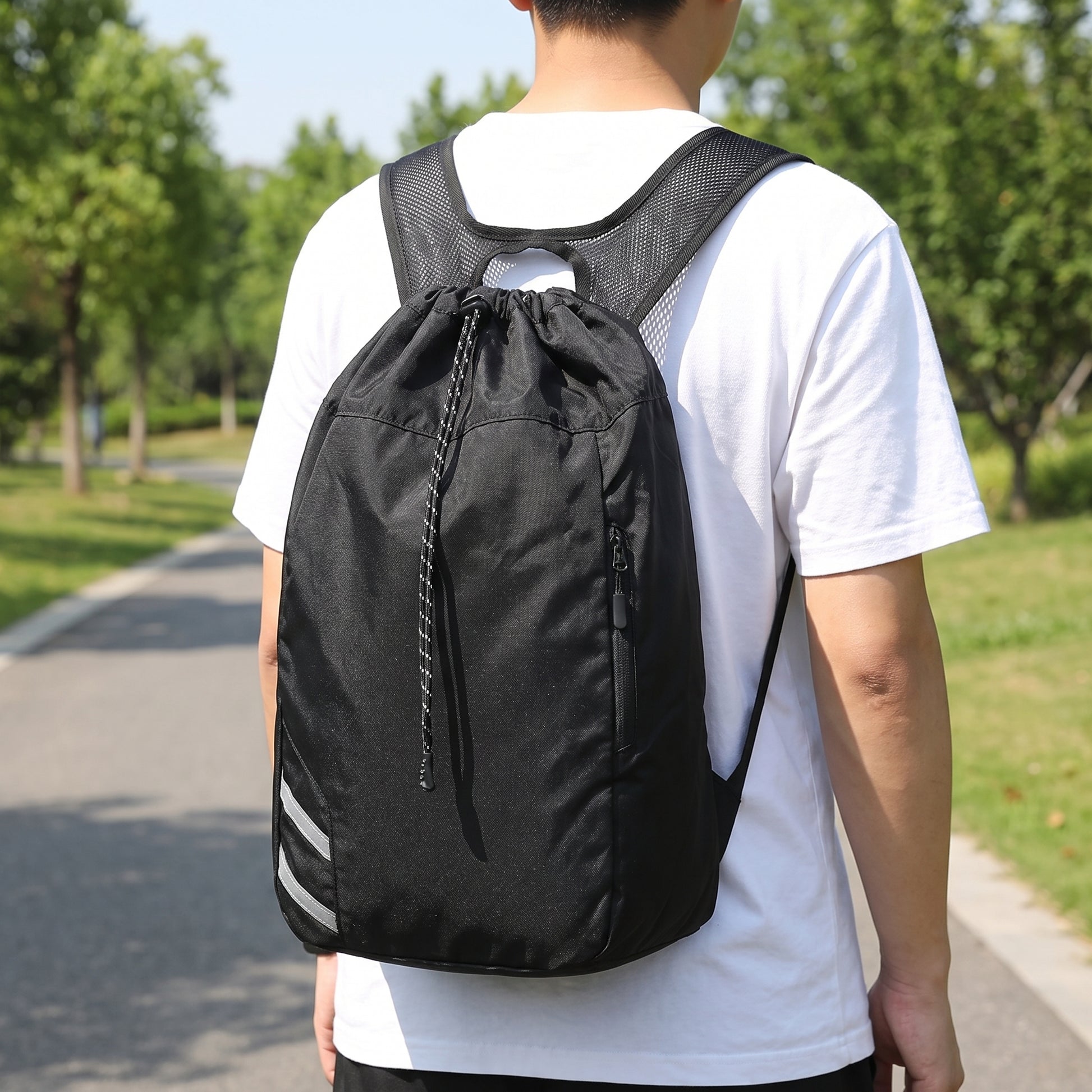 Backpack Gym Bag Drawstring Black Nylon Padded Shoulder Straps - in-use